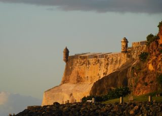 Sunset On El Morro And Old San Juan, PR, Viewed From San Juan Bay