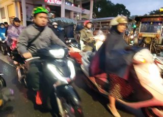 Rainy Rush Hour Motor Scooter Traffic Jam, Hanoi, Vietnam