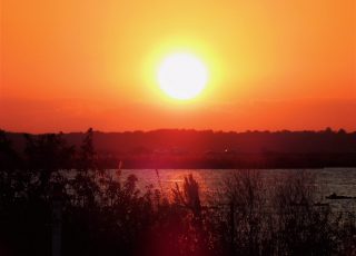 I-75 Traffic Crossing Paynes Prairie As Sun Sets Over Wetland