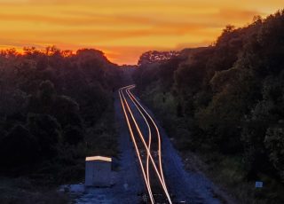 Sunset On Railroad Track At 36th Avenue Overpass