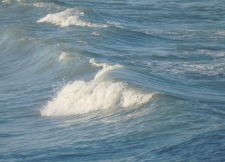 Close-Up View Of Waves Crashing On Daytona Beach